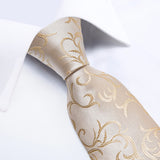 Beige tie with gold floral pattern on a white background