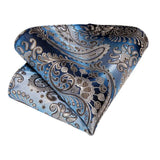 Blue and silver paisley patterned pocket square on a white background