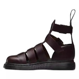 Side view of a stylish dark brown gladiator sandal featuring wide straps and a thick sole, perfect for a trendy summer look.