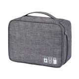 Gray accessory organizer bag with a sturdy handle and icons for charging cables, designed for travel and convenience.