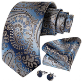 Blue paisley tie set with pocket square and cufflinks on a white background