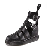 Black gladiator-style sandal with multiple straps, a thick sole, and a pull tab at the back, photographed against a white background.