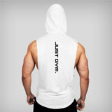 Muscular man wearing a sleeveless white hoodie with "JUST GYM." printed vertically on the back, facing away from the viewer.