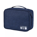 A compact, navy blue tech organizer bag with a handle and various charging icon graphics on one side.