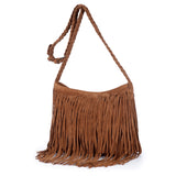 Brown suede shoulder bag with braided strap and long fringes, showcasing a bohemian, stylish design.