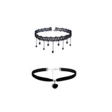 Two black chokers are displayed on a white background. The top choker features lace and dangling beads, while the bottom has a smooth band with a heart charm. Both convey elegance.