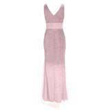 Elegant sleeveless pink evening gown with a V-neckline, featuring sparkling embellishments fading down the skirt, conveying sophistication and grace.